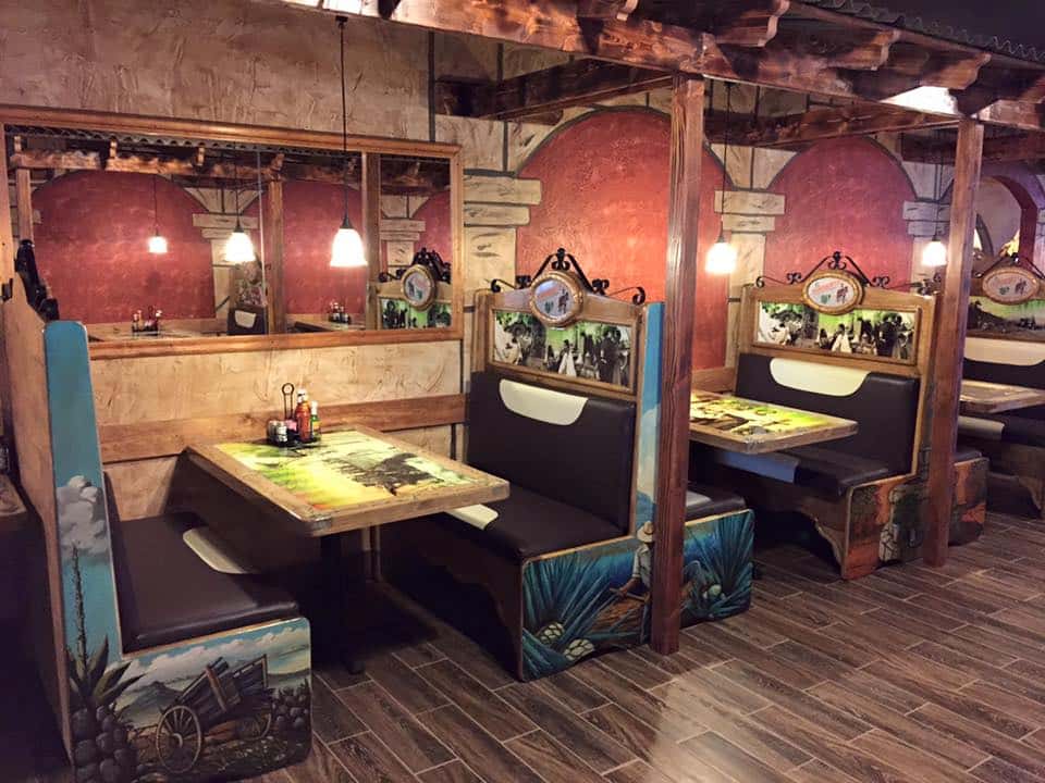 Interior dining area with booths and tables set up