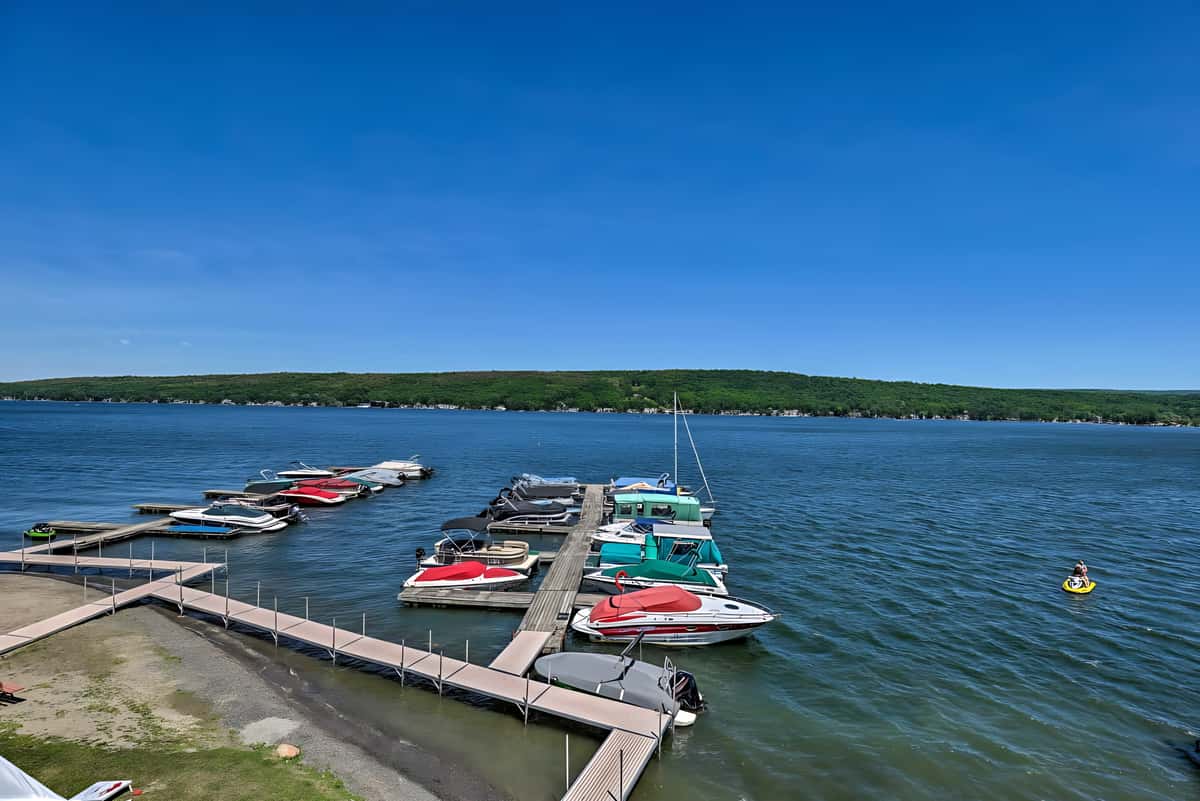 Lakeside building at Beachcomber with scenic views of Conesus Lake and outdoor gathering spaces.