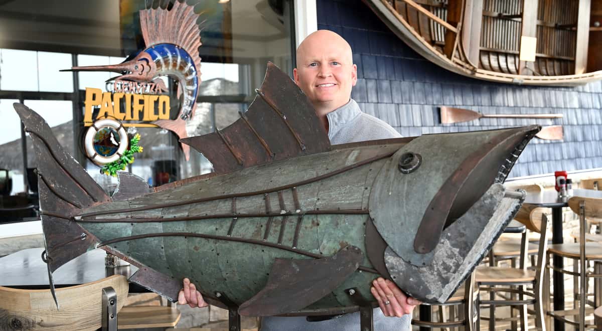 blair with fish sculpture