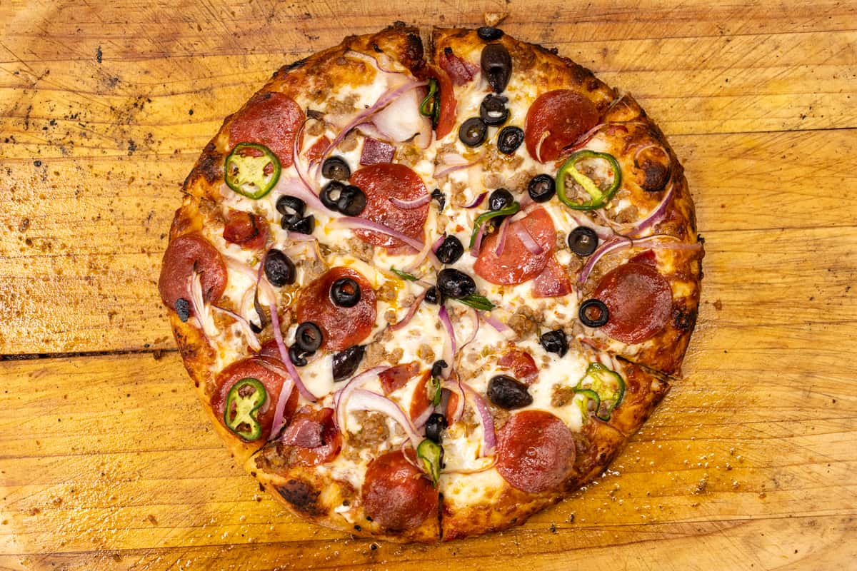 pizza with olives, jalapeno and pepperoni