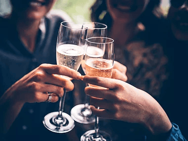 people toasting champagne flutes