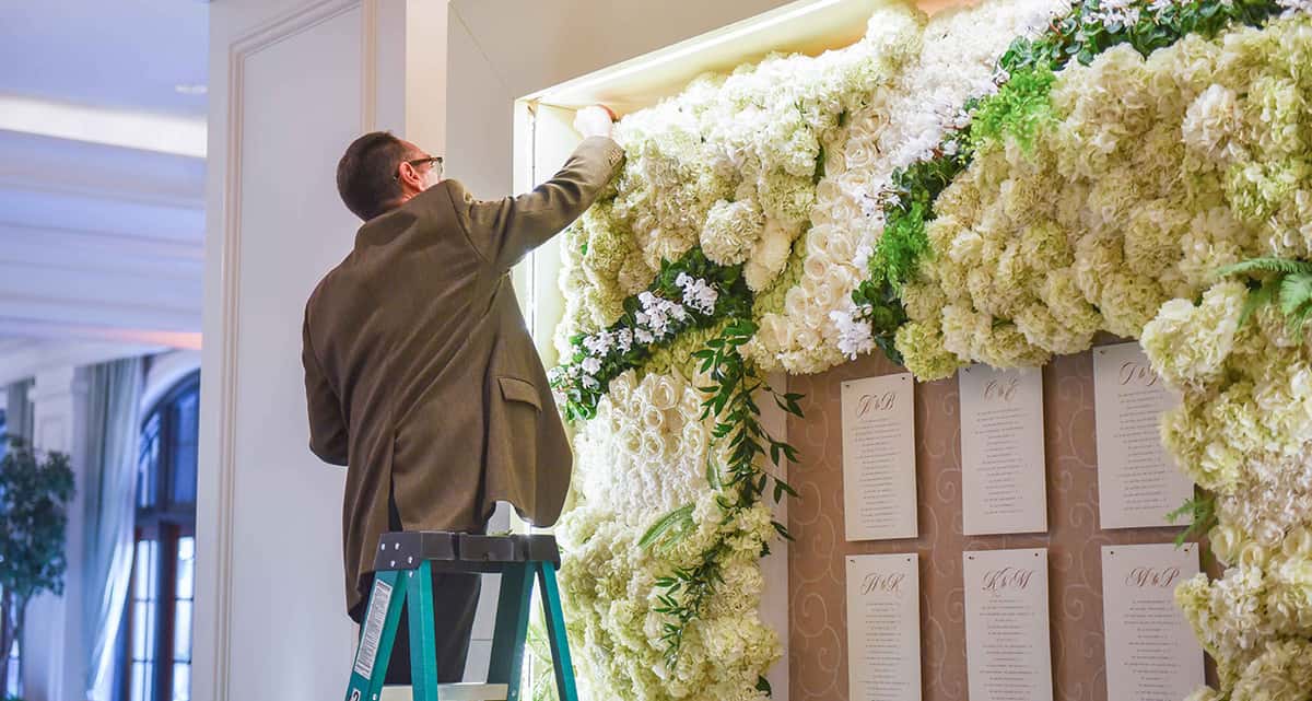 Designer hanging up decorations