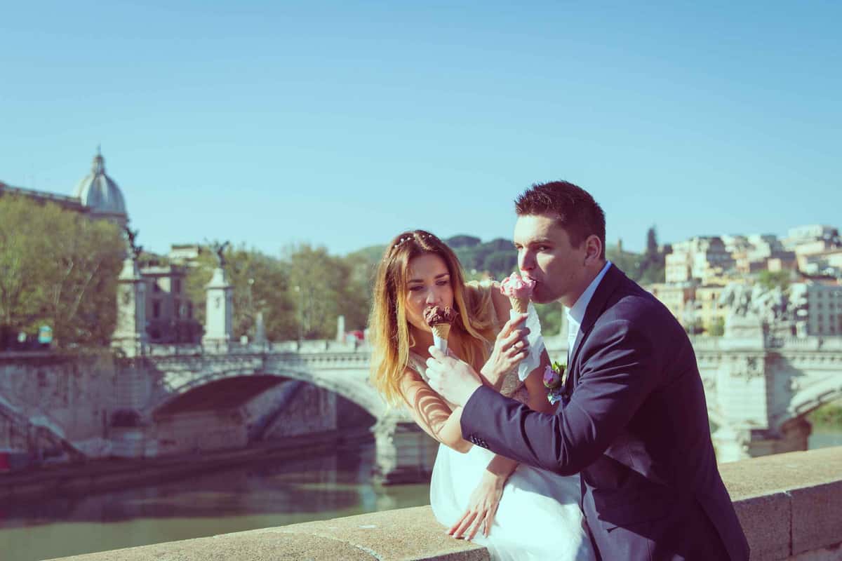 bride and groom eating an ice cream