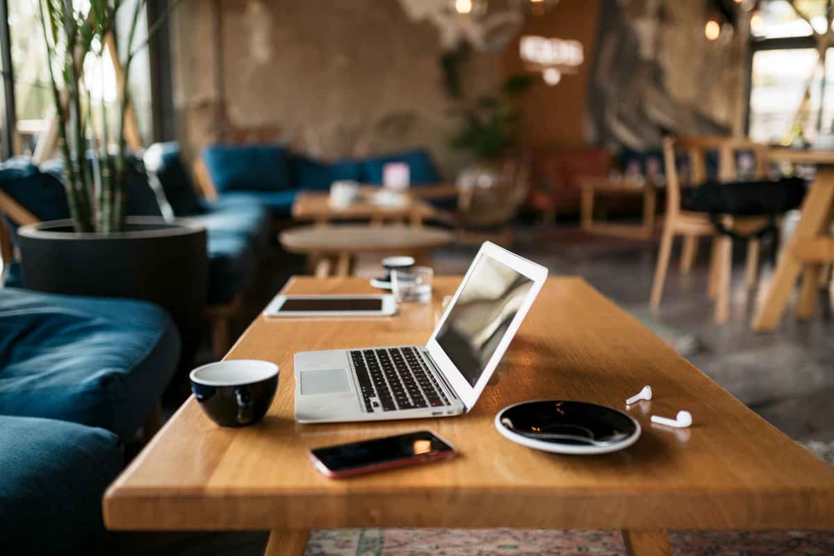 table with a laptop and coffee