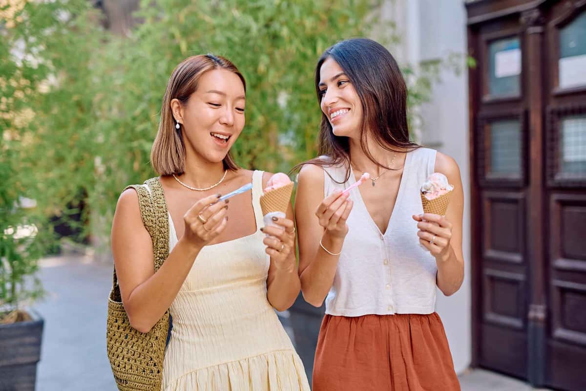 two people holding ice creams