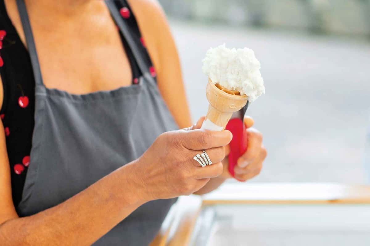ice cream being scooped in a cone