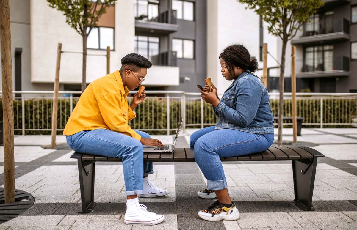people sitting down with an ice cream