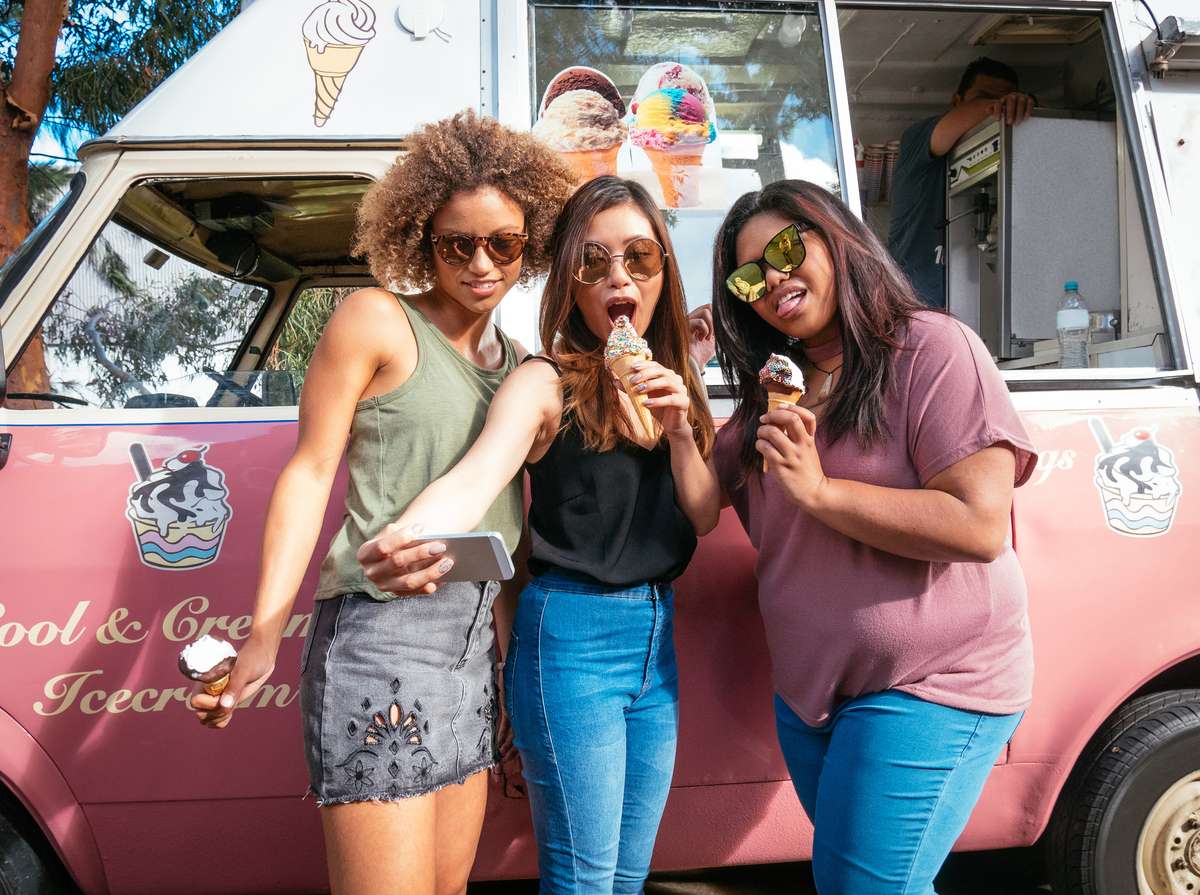 food truck with three people eating ice cream