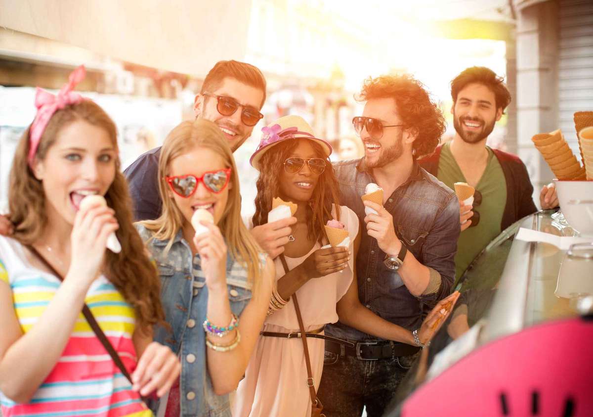 a group of people eating ice cream