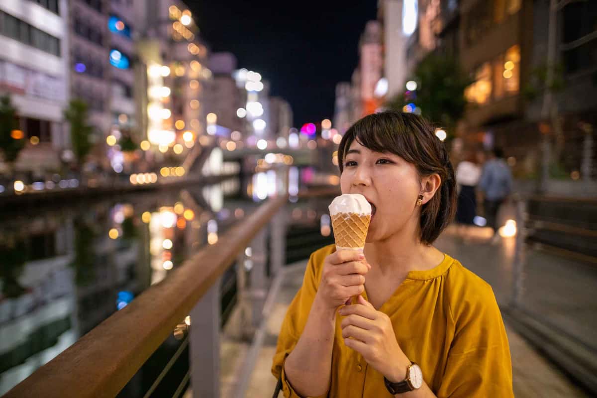 one person eating ice cream at night
