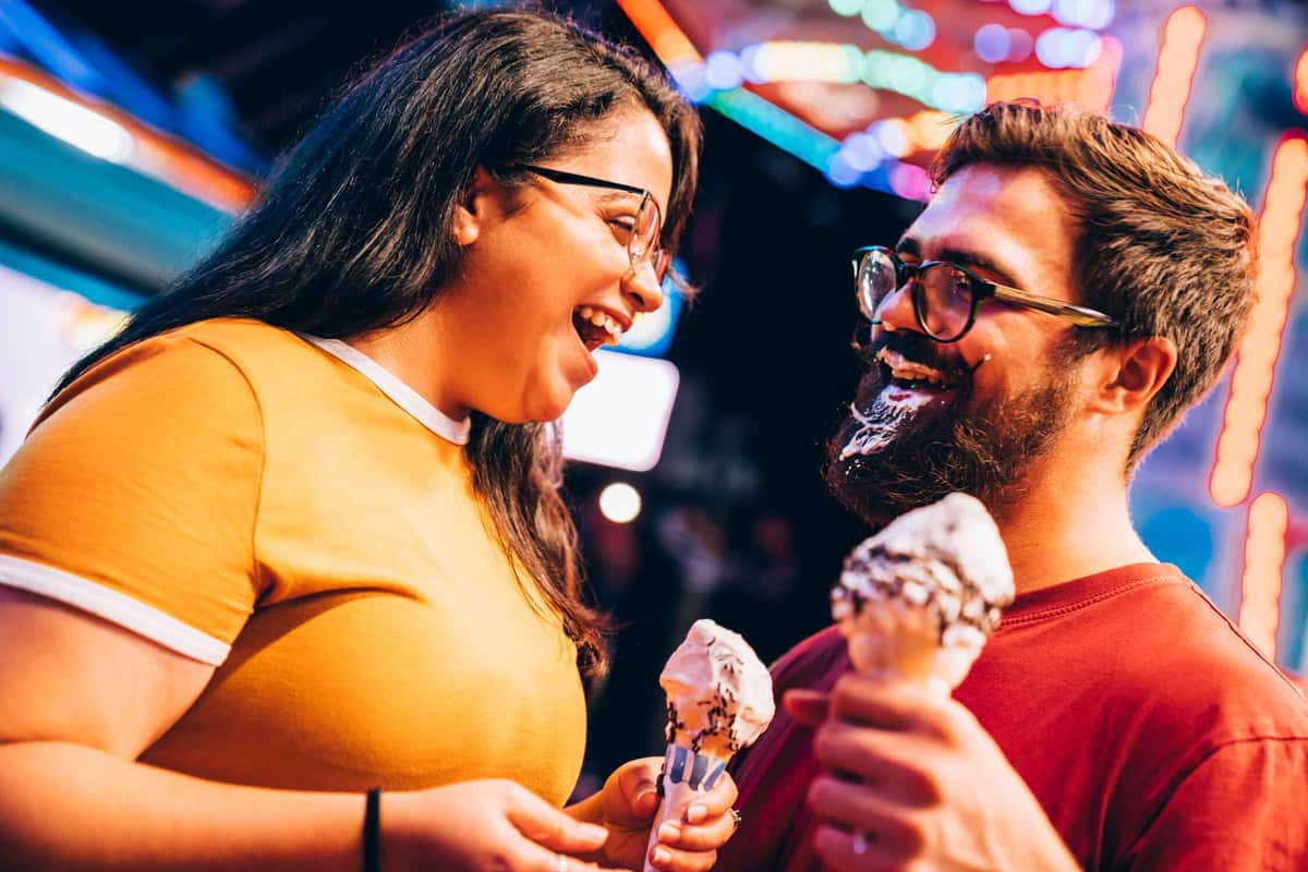 two people holding ice creams