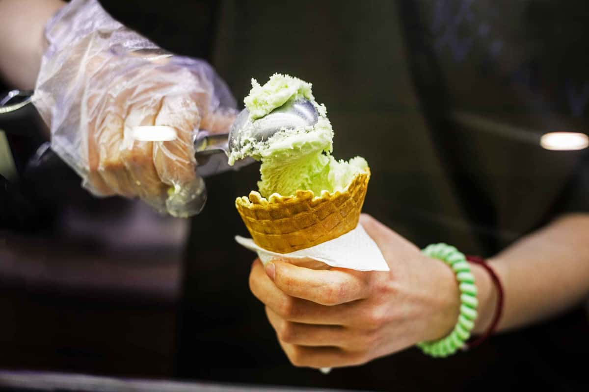 putting ice cream in a cone 