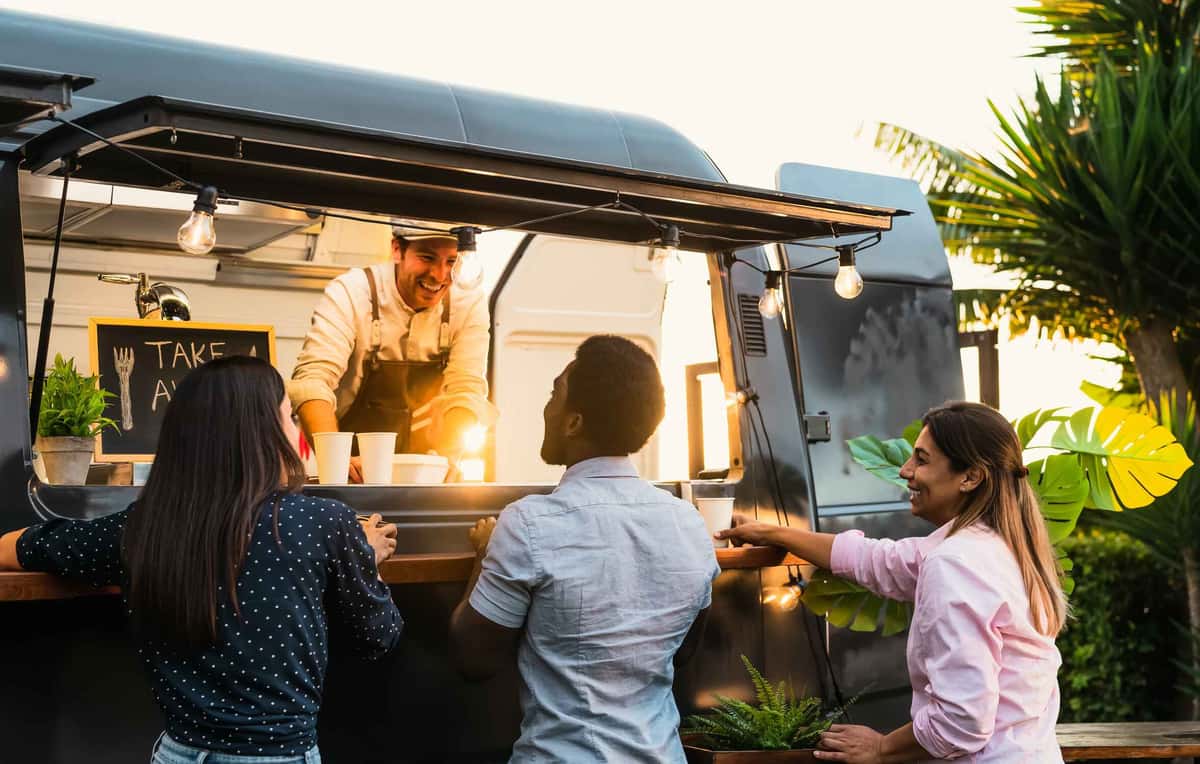 food truck with three customers