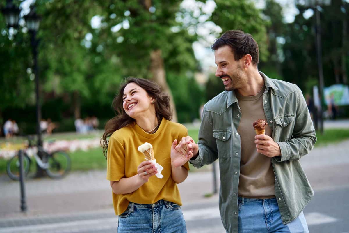 two people holding ice creams