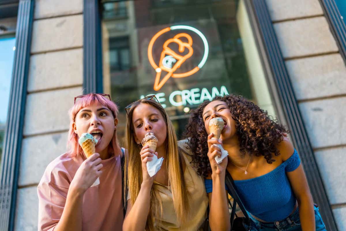 three women eating ice creams