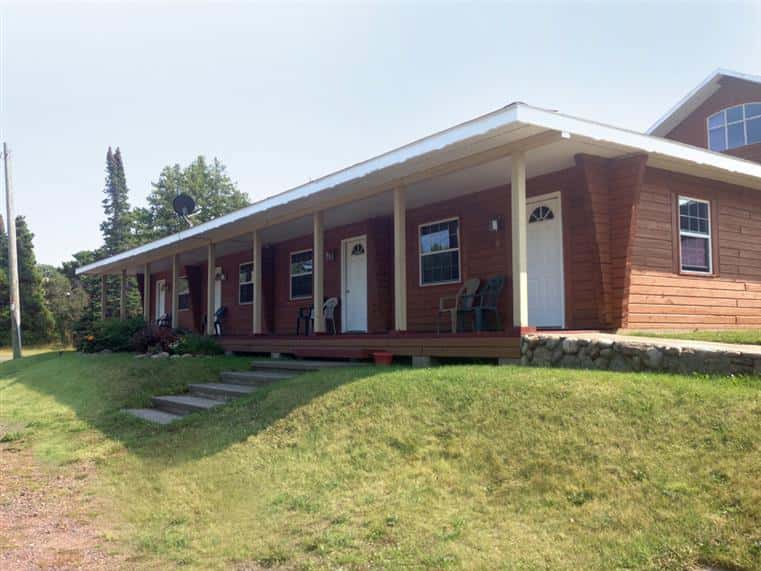 Single story motel exterior view.