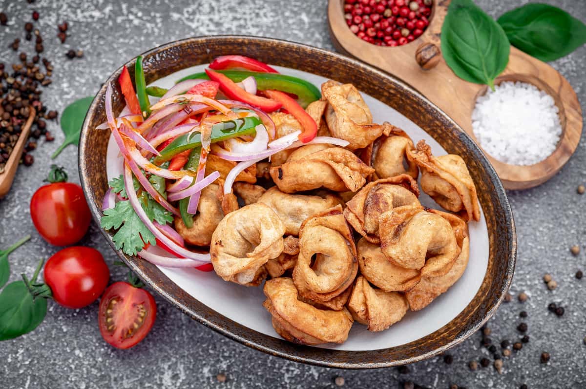 Crispy fried wontons with peppers and onions at Laghman Express