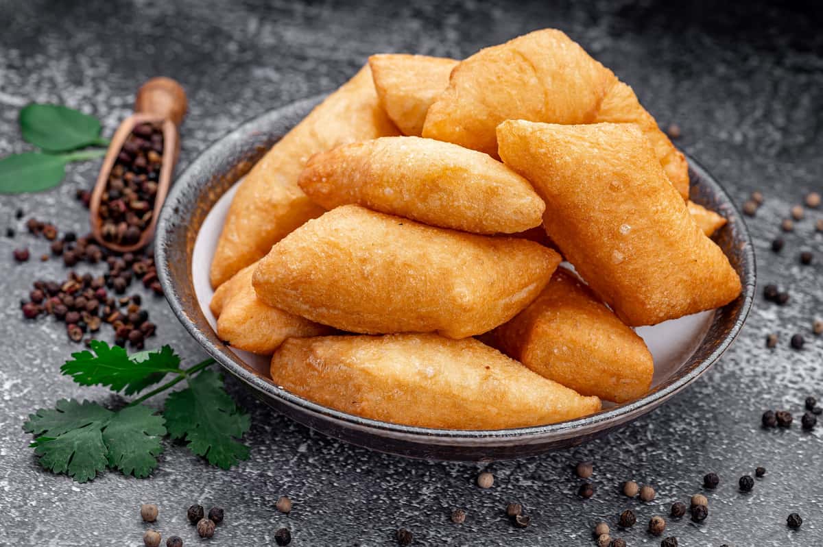 Golden fried Central Asian pastries served fresh and crispy