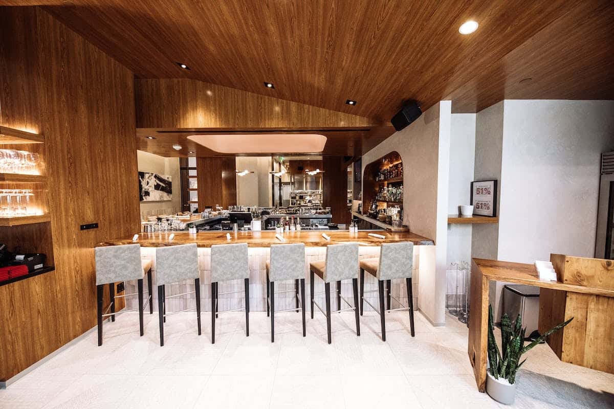 a kitchen with wooden cabinets and a dining room table