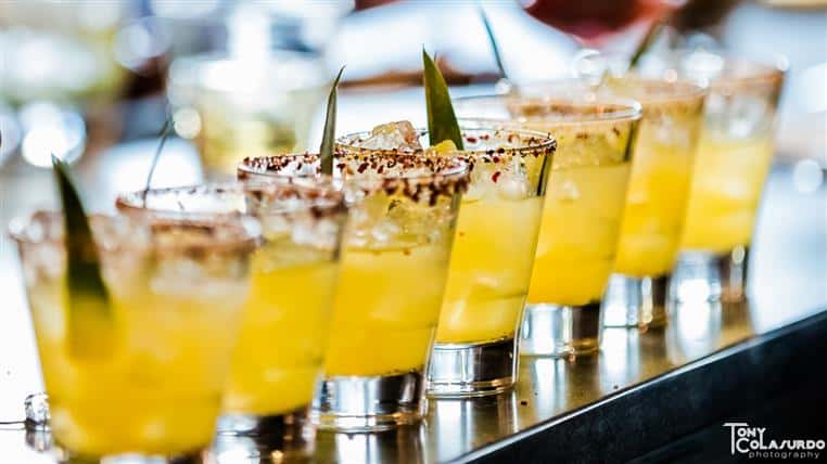 Cocktails lined up on bar