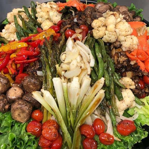 various assorted vegetables on a platter ready to be served at an event