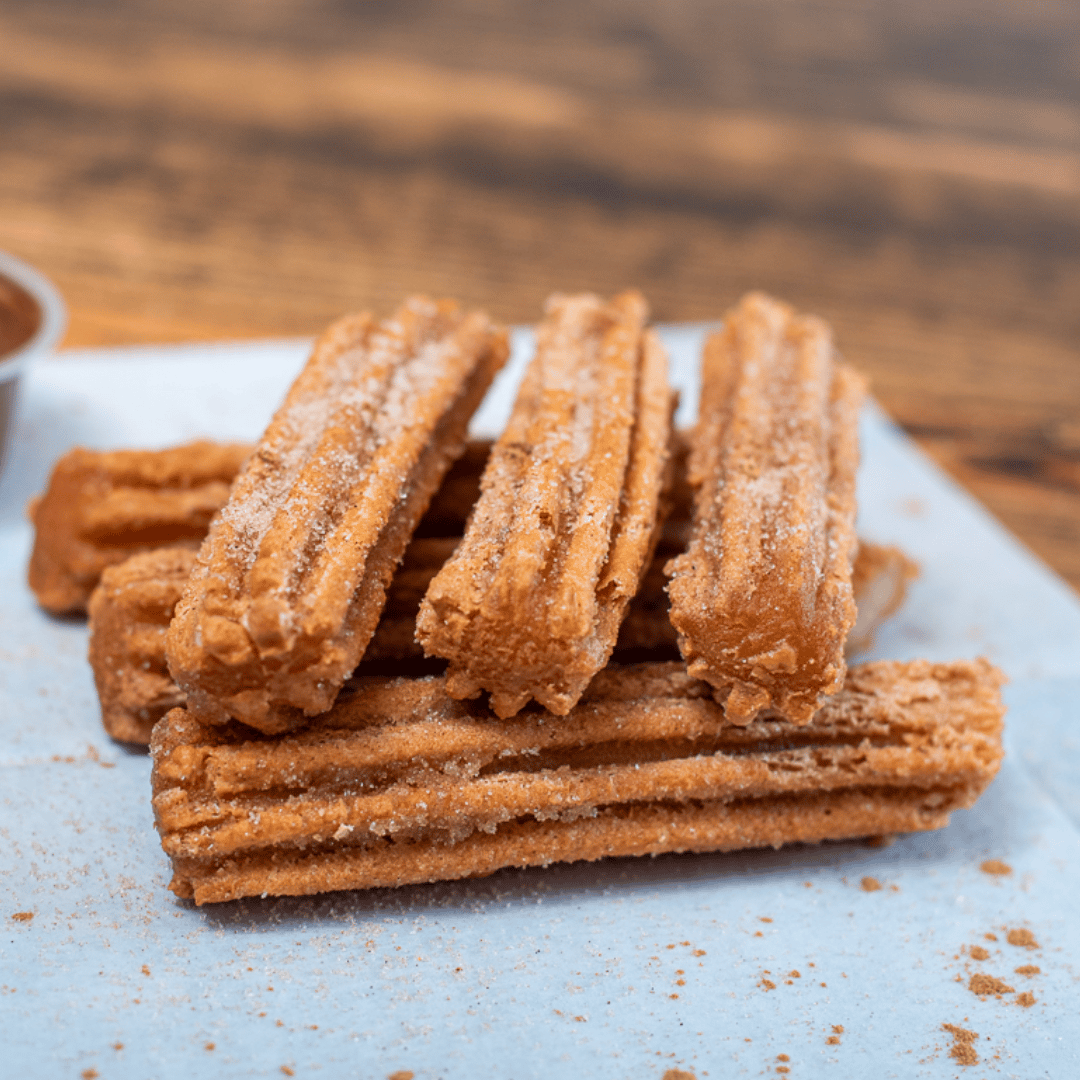 A traditional "street" favorite, served warm & crispy with large sides of hazelnut dipping sauce or berry dipping sauce (12 per order, halved or quartered upon request)