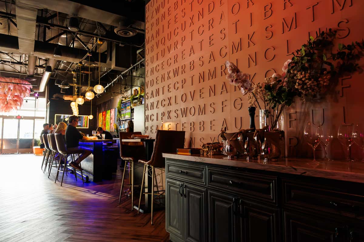Upscale bar and lounge interior with contemporary décor, stylish seating, and a sophisticated social atmosphere at EVO North Scottsdale.