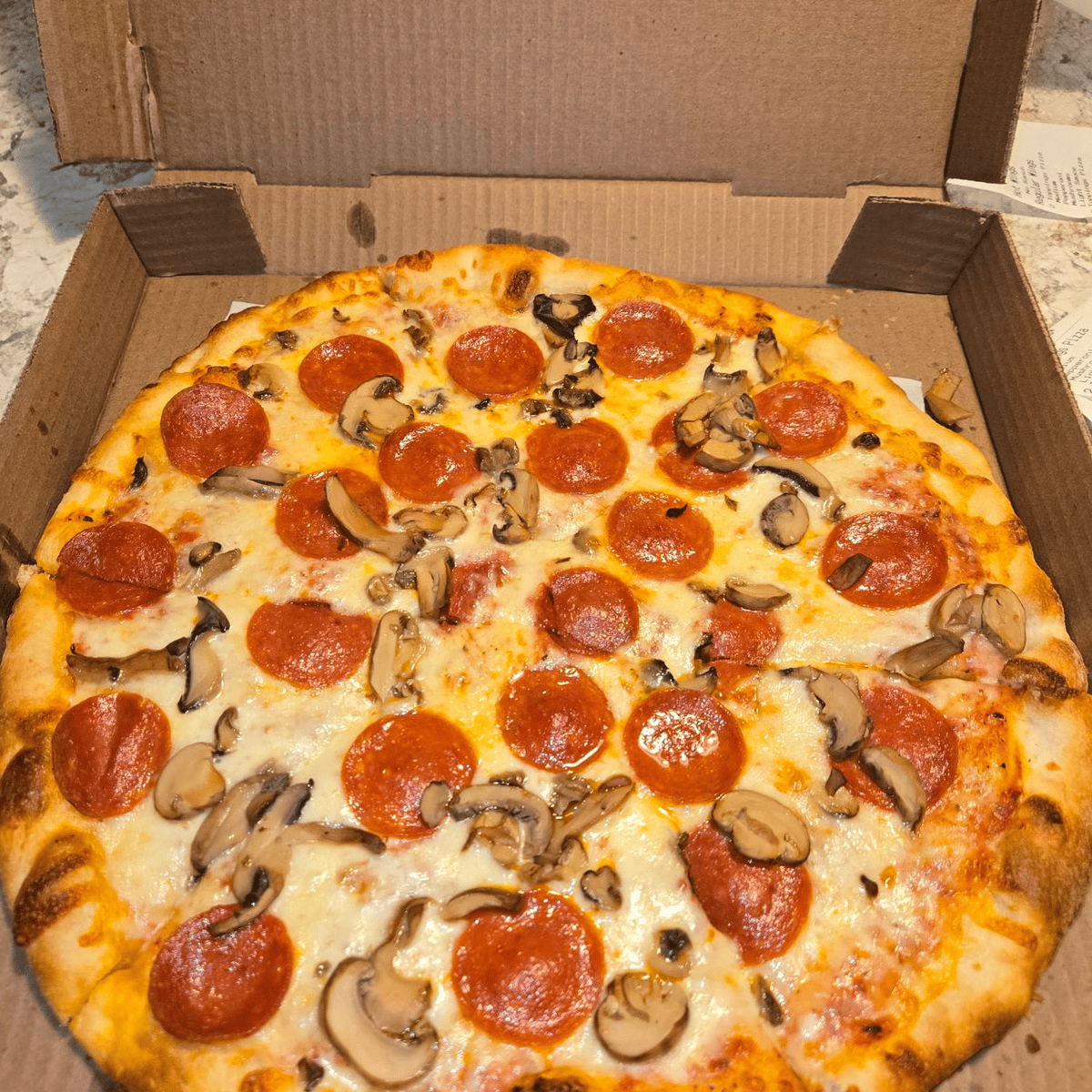 Pizza with pepperoni and cheese