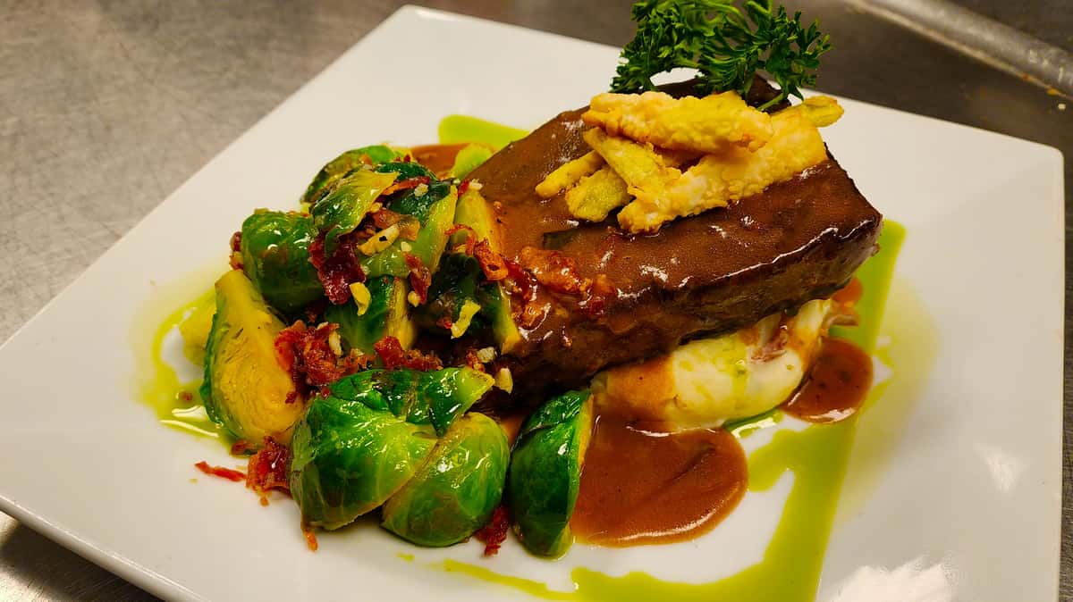 dish with veggies and meat with sauce