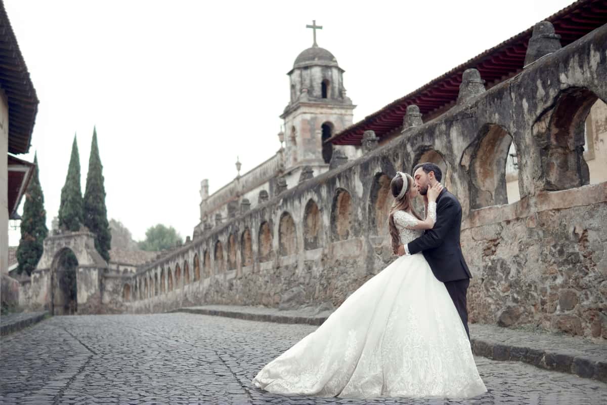 married couple in front of church