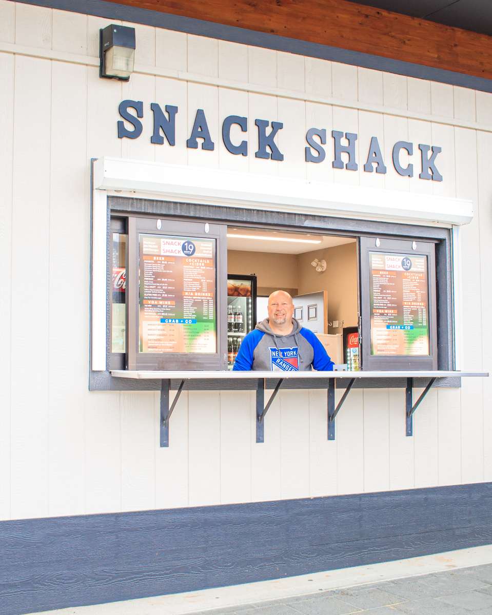 neil smiling in snack shack