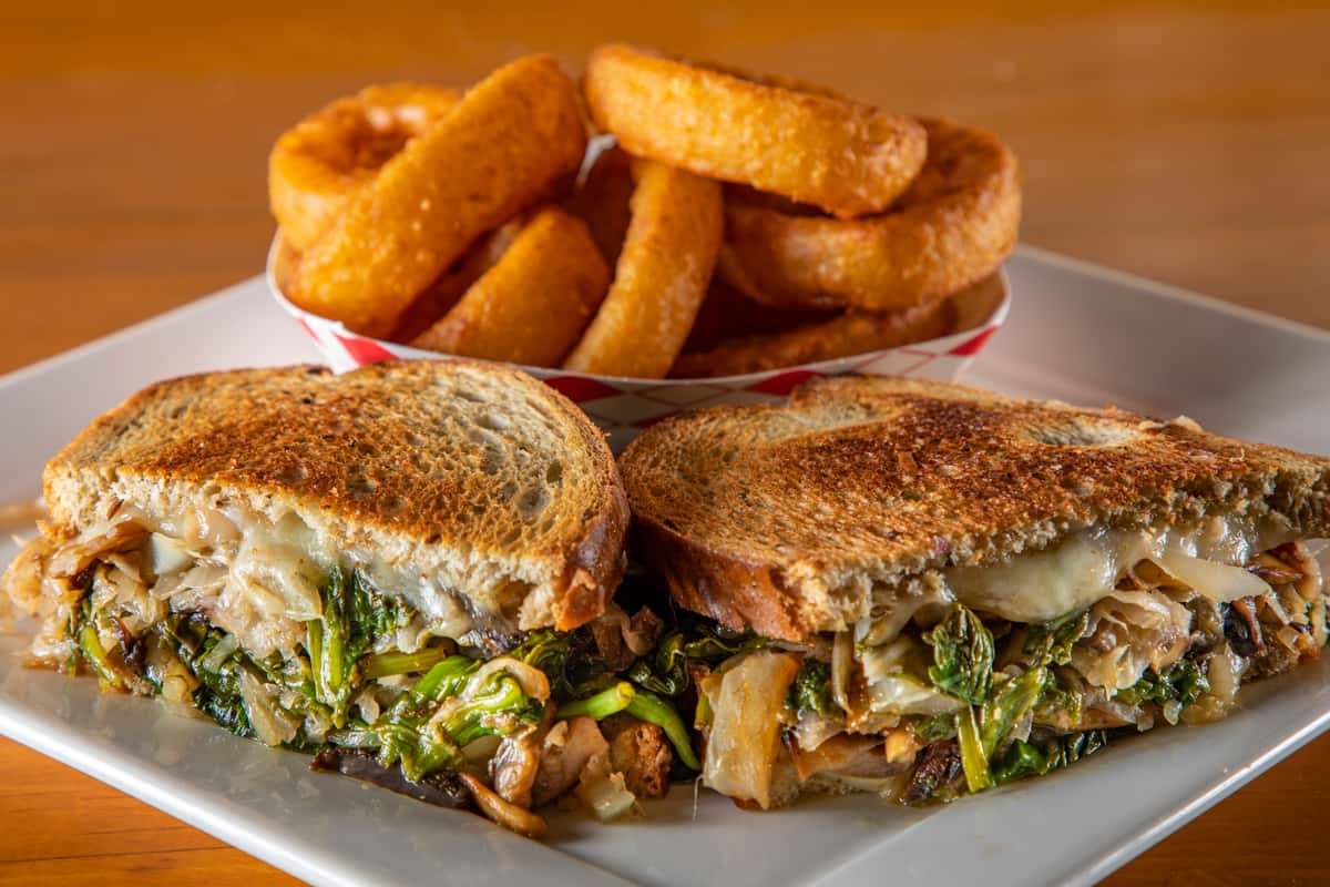 SF Style Reuben sandwich served with a side.