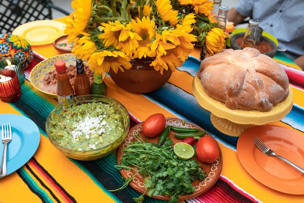 Table spread of mexican entrees and ingredients