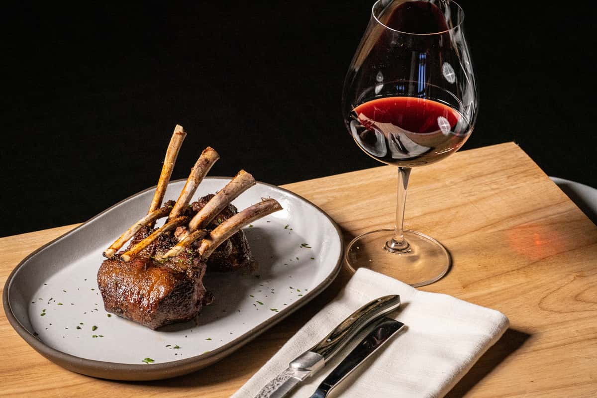 Wine glass with a rack of lamb 