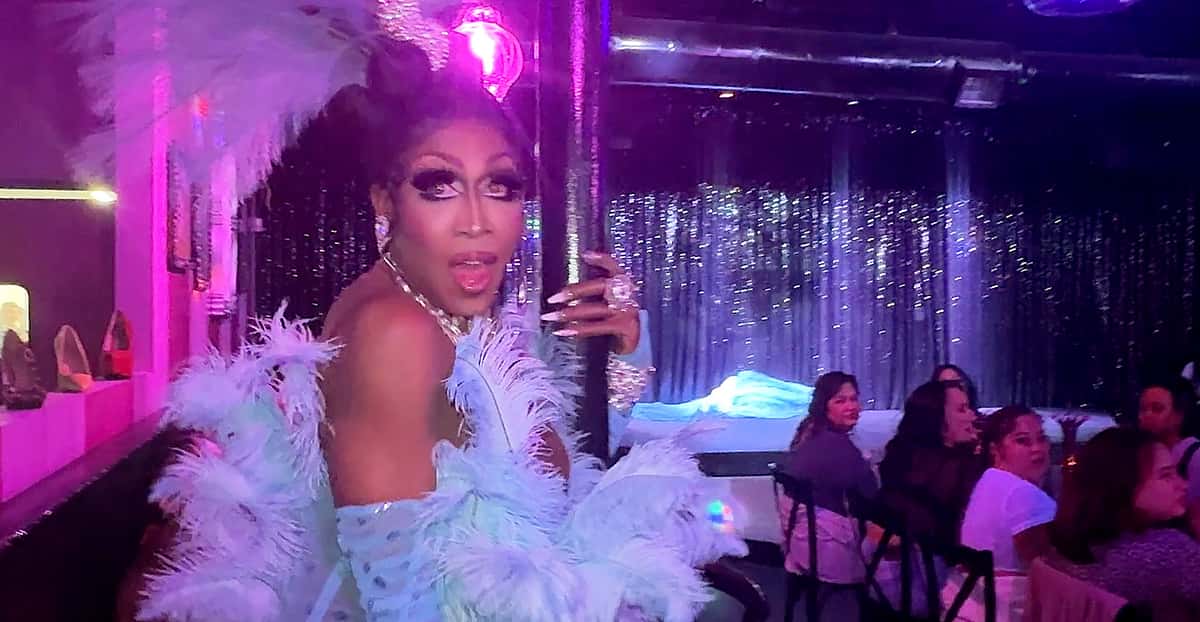 Drag Queen in blue performs for guests