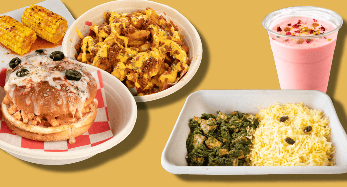 Indian fusion meal with loaded masala fries, cheesy sandwich, grilled corn, palak paneer with rice, and a pink rose milk drink, styled on a bright yellow background.