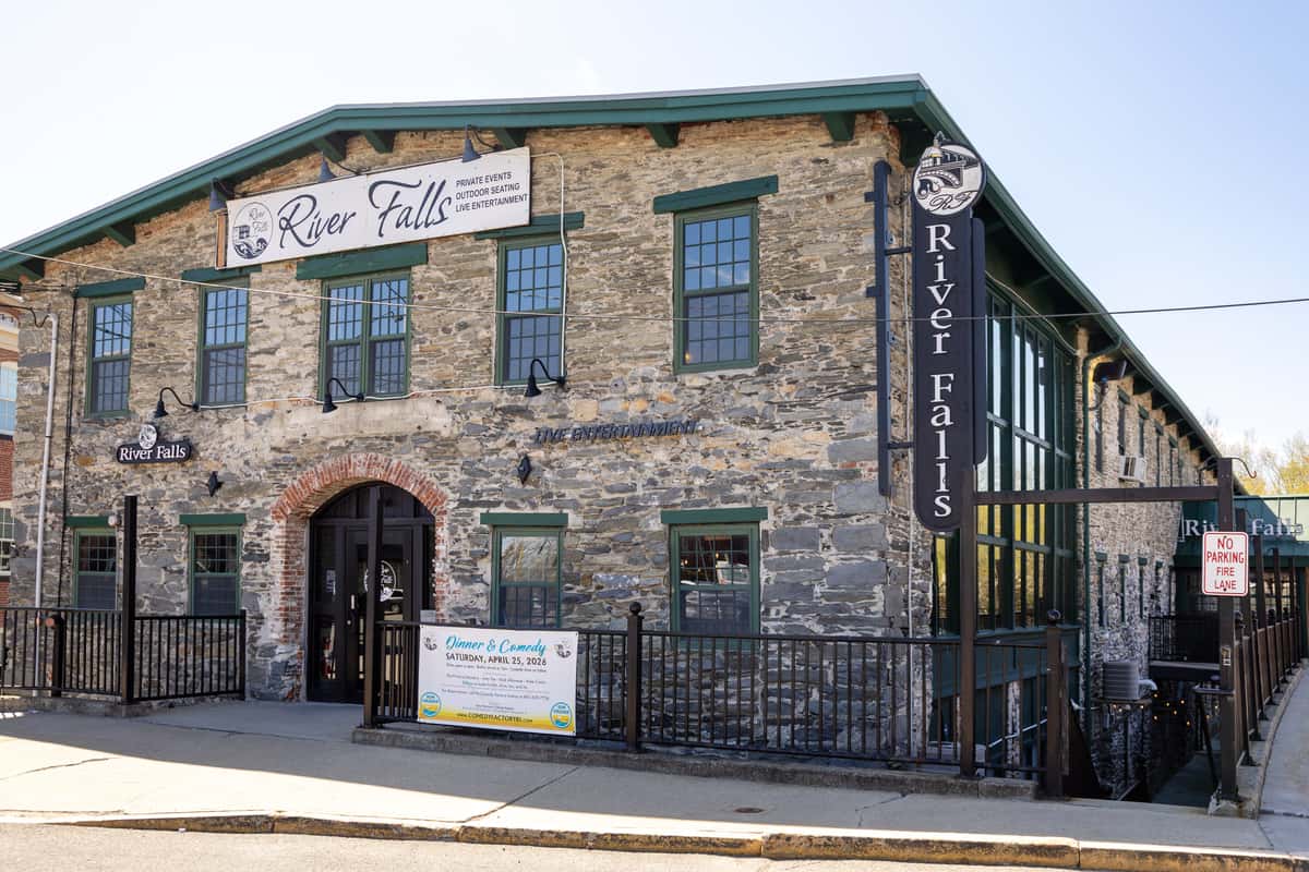 stone restaurant exterior with rustic architecture and welcoming entrance on a sunny day