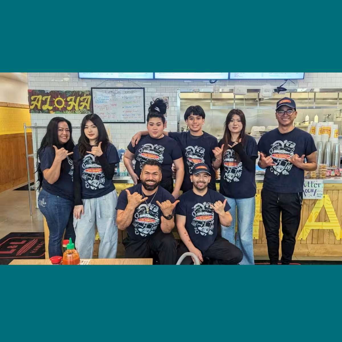A group of L&L team members posing for a photo