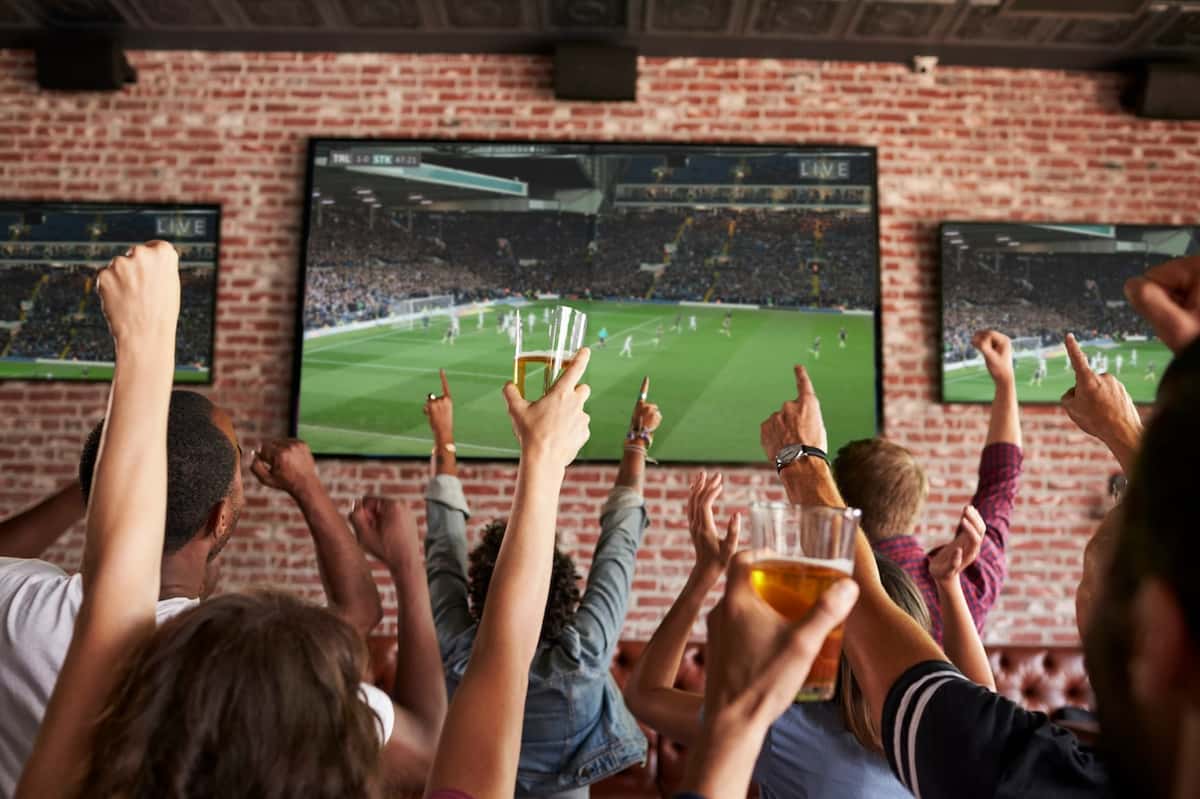 fans watching sports at a bar