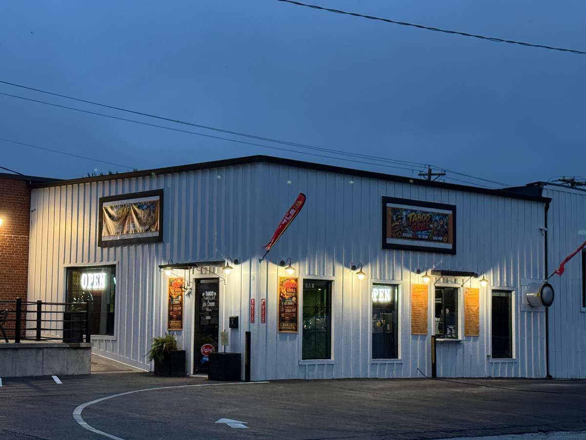 Restaurant exterior with warm lighting at night