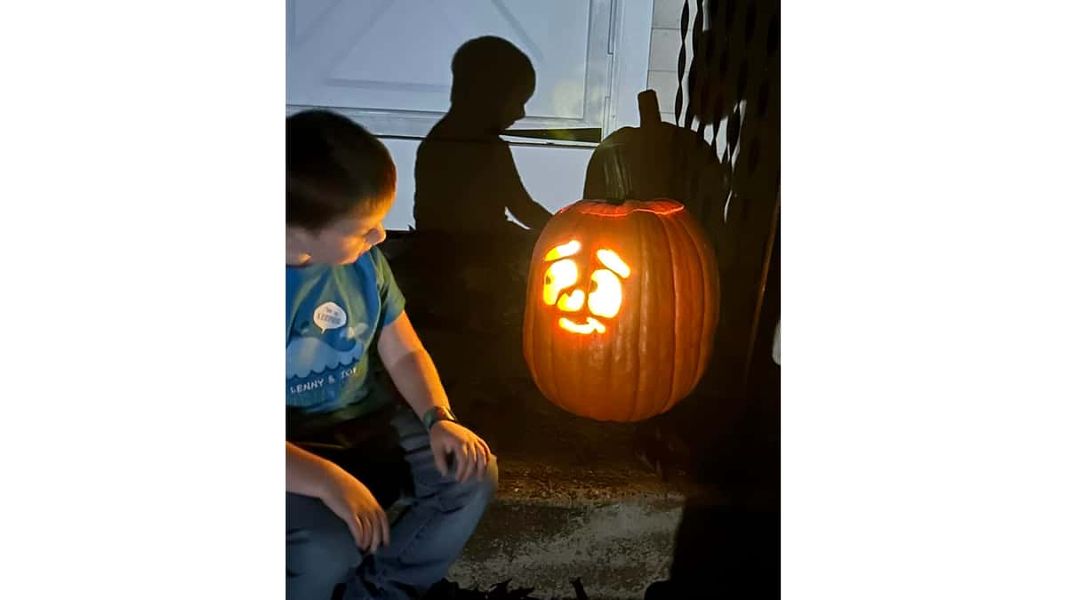 Young Pumpkin Carver wearing Fish Tale Shirt