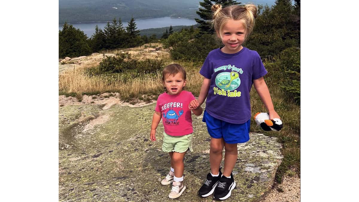 2 young sisters in Fish Tale Shirts in Maine