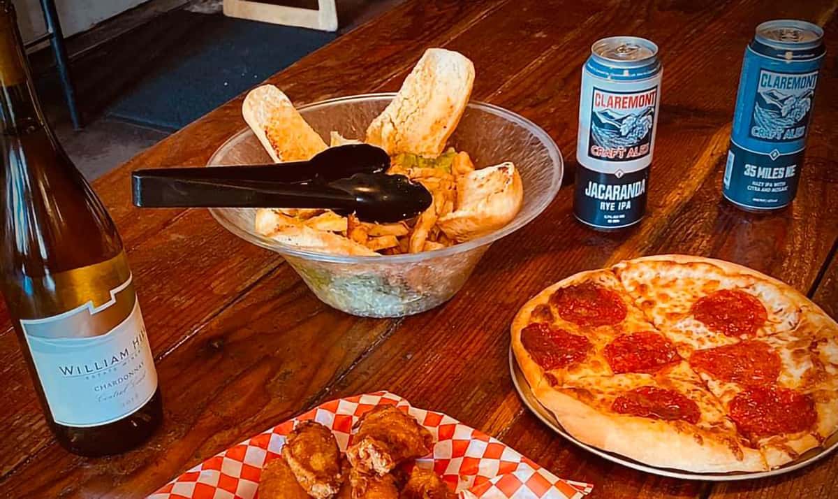 Wine, beer, wings, pizza, and salad