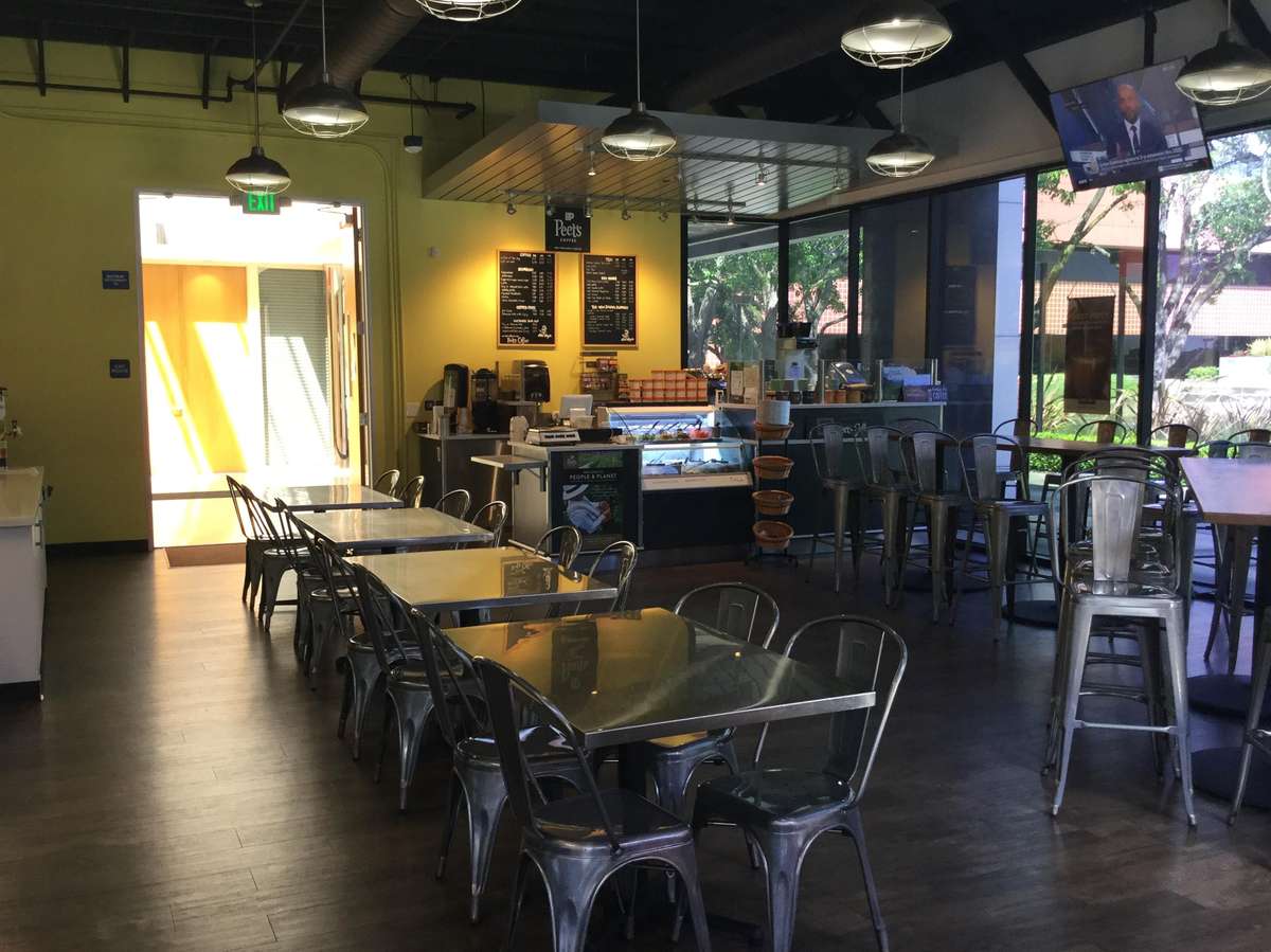 Interior dining area with tables and chairs set up