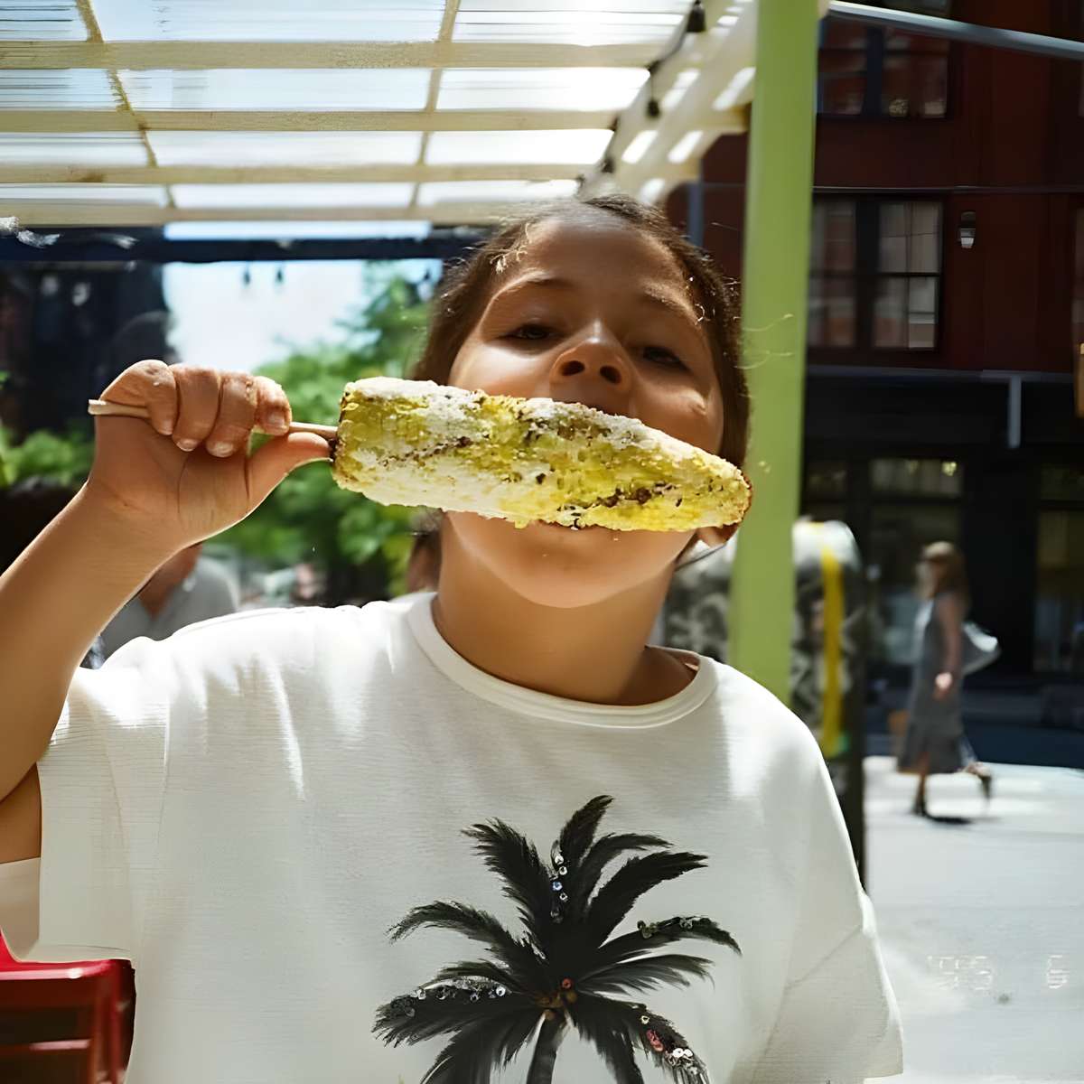 Girl eating corn