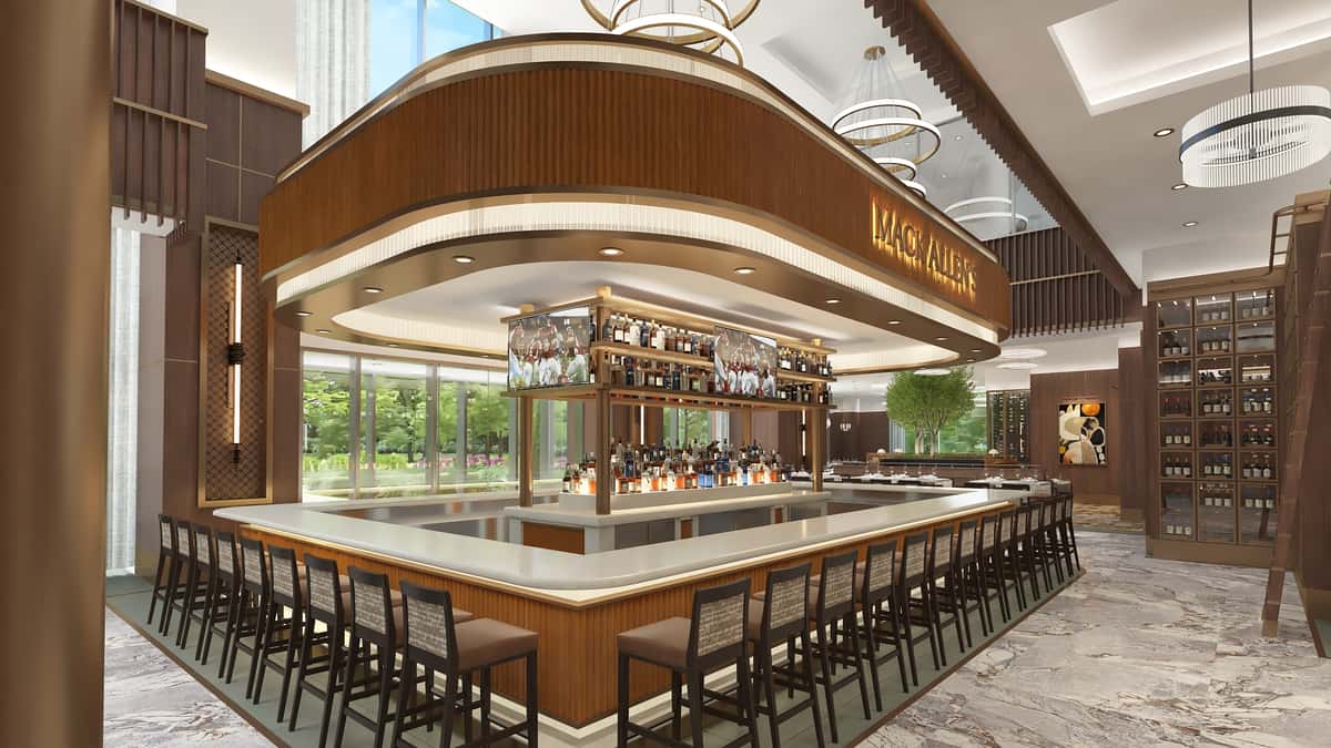 Elegant central bar with wraparound seating, illuminated bottle displays, and sophisticated contemporary restaurant design.