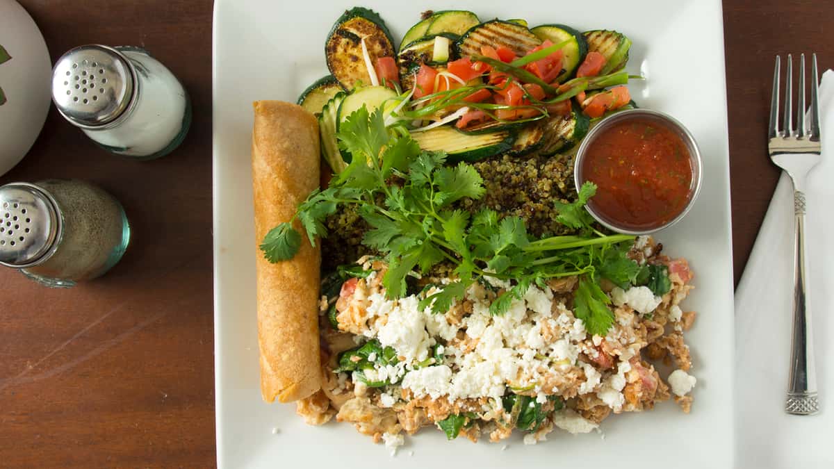 egg whites, organic spinach, vegan sausage, feta, green onion, tomato, corn tortilla, side of organic quinoa, zucchini.

protein 33 – fiber 12 – carb 63 – fat 16 – cal 543