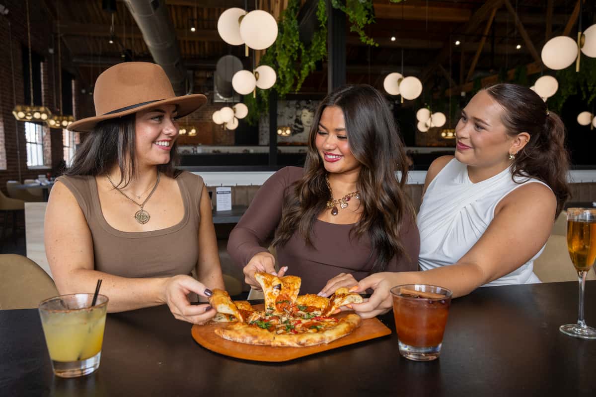 friends sharing pizza