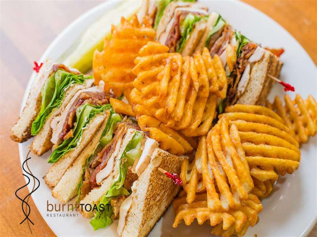 Turkey Club Sandwich with waffle fries