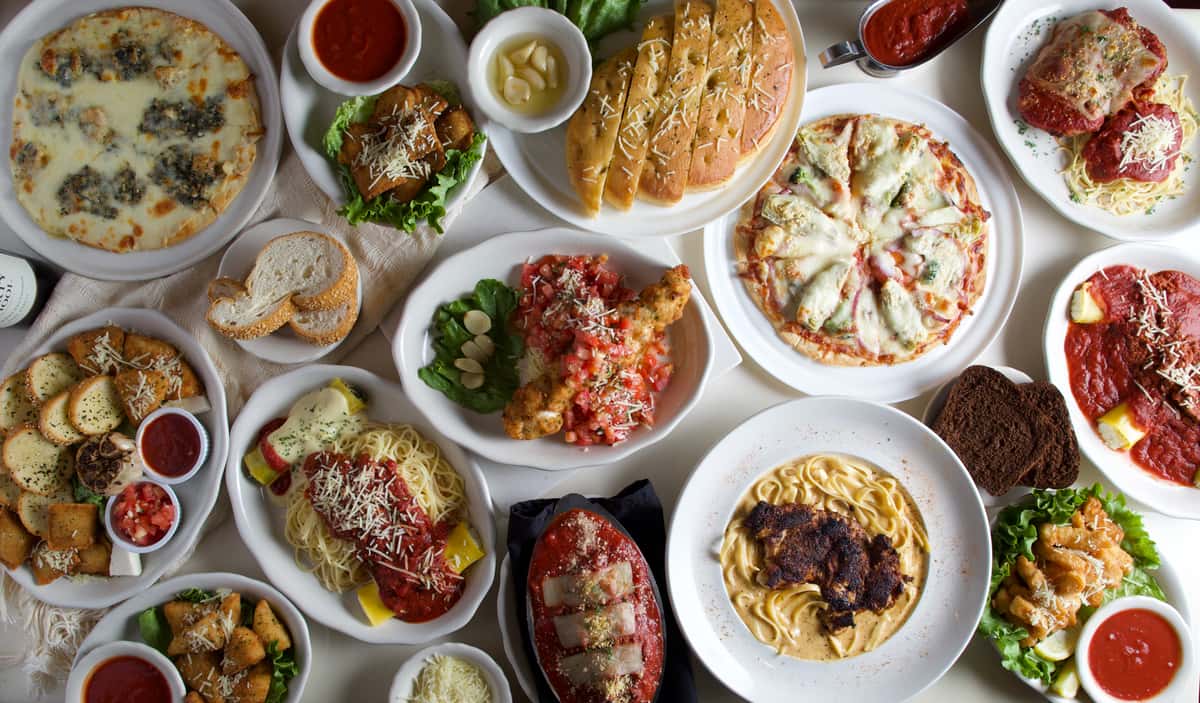 Top view of a table filled with plated meals